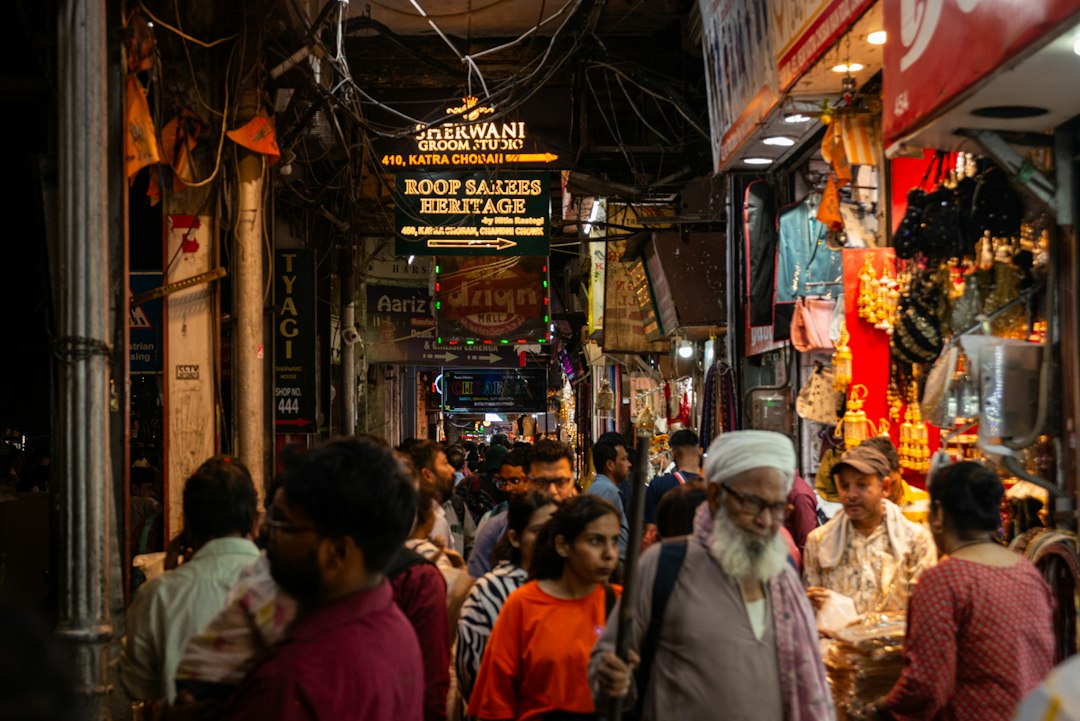Crowded street market with shops and people